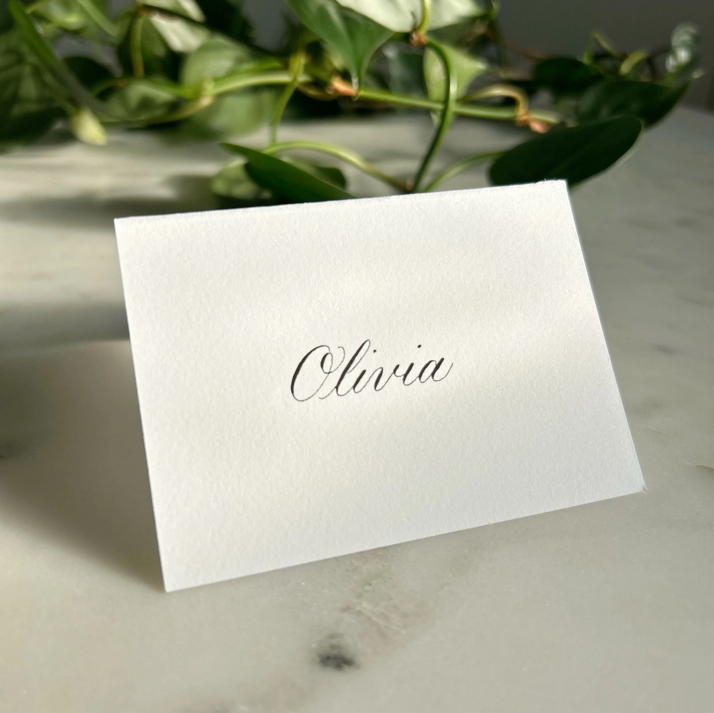 Place card with traditional script calligraphy