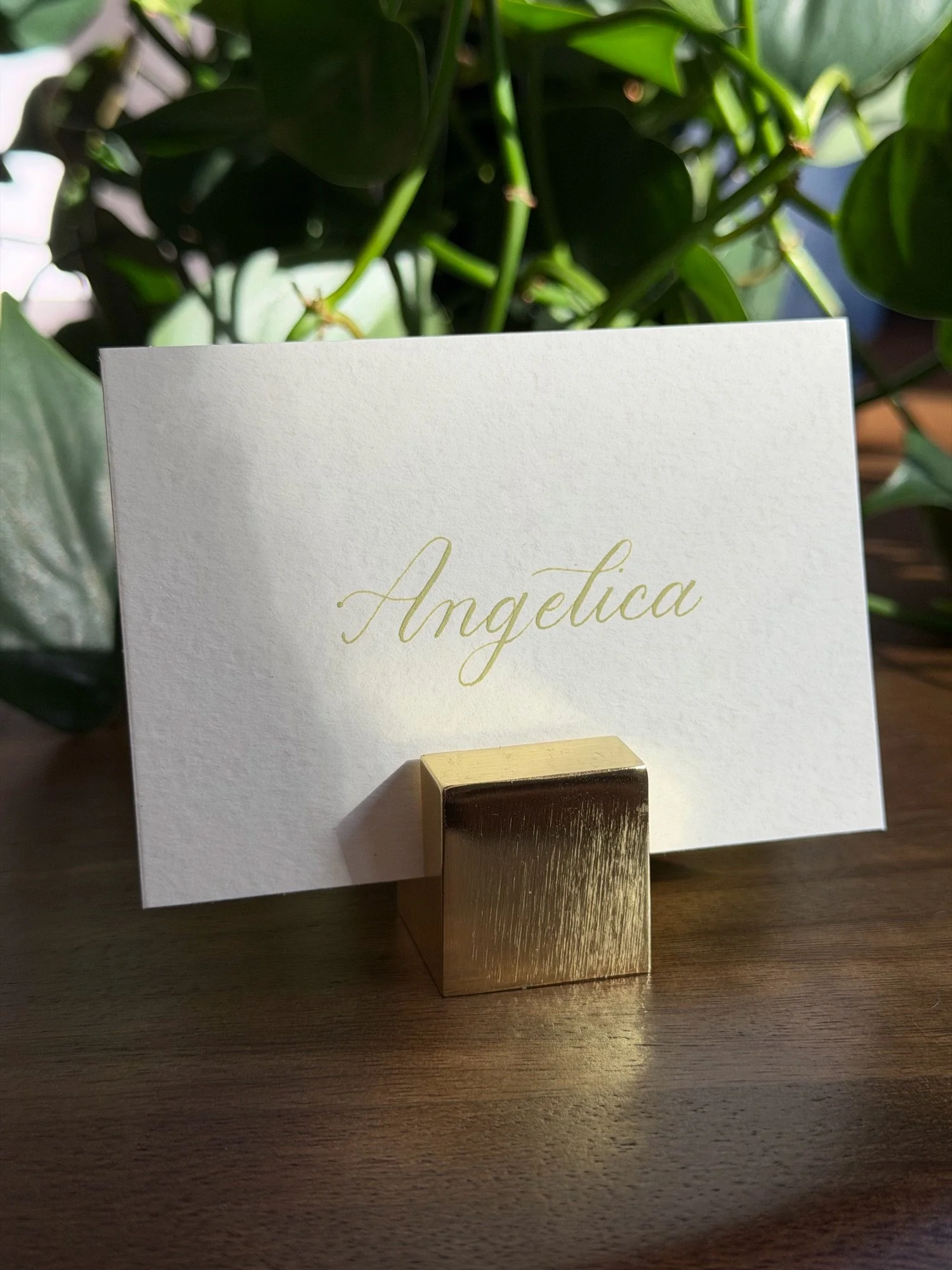 Custom matched green ink calligraphy on ivory place card