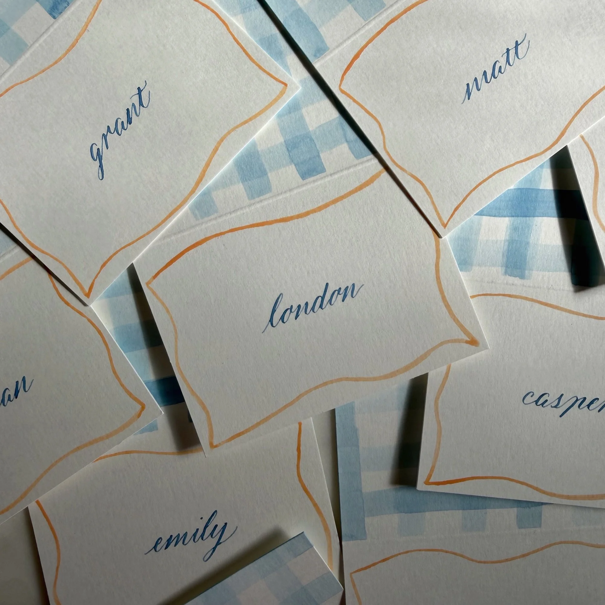 Watercolor place card calligraphy in gingham design