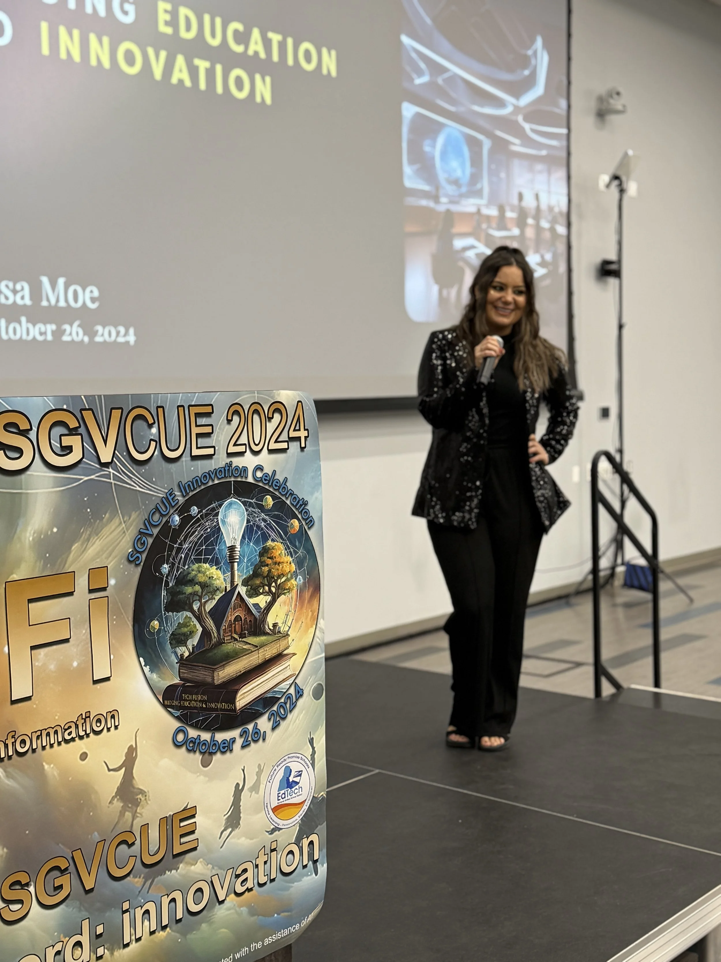 Lisa Moe in a sequined jacket speaking on stage at the SGVCUE 2024 Leading Education Innovation keynote