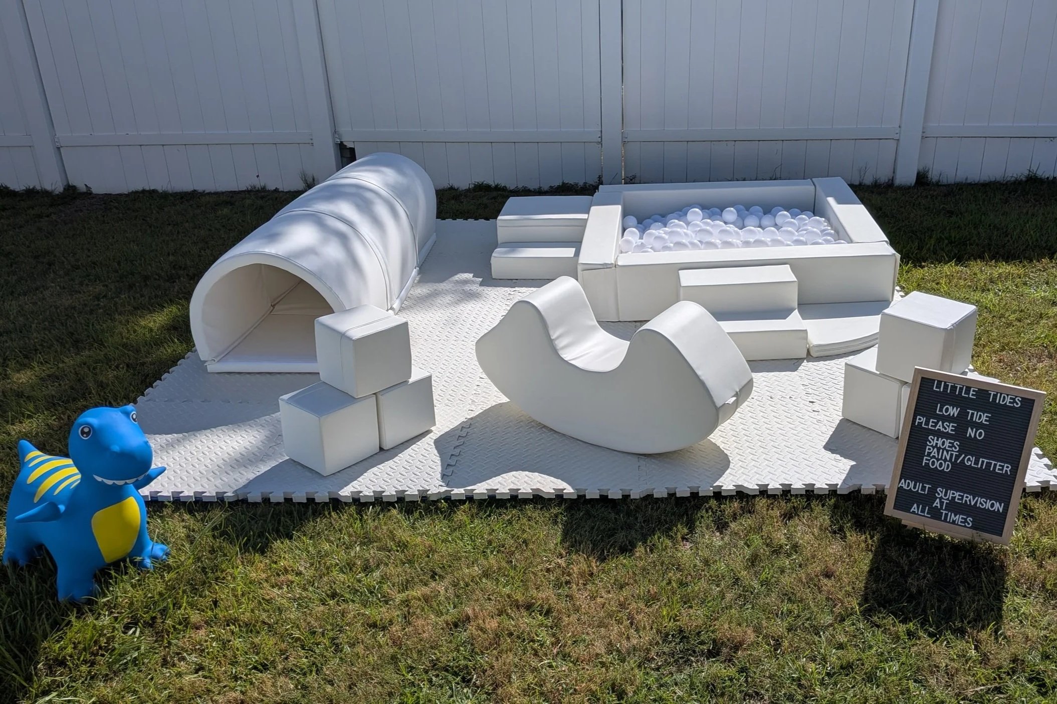Soft play package with ball pit, rocker, stairs, wedge slide, tunnel, stacking blocks, and foam mat.