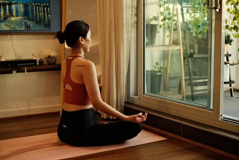 A seated twist by the window