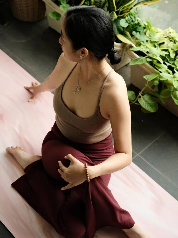 A quiet moment, hands resting in mudra