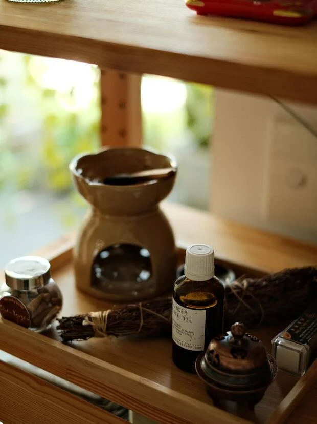 Lavender oil and incense, part of the studio's quiet rituals