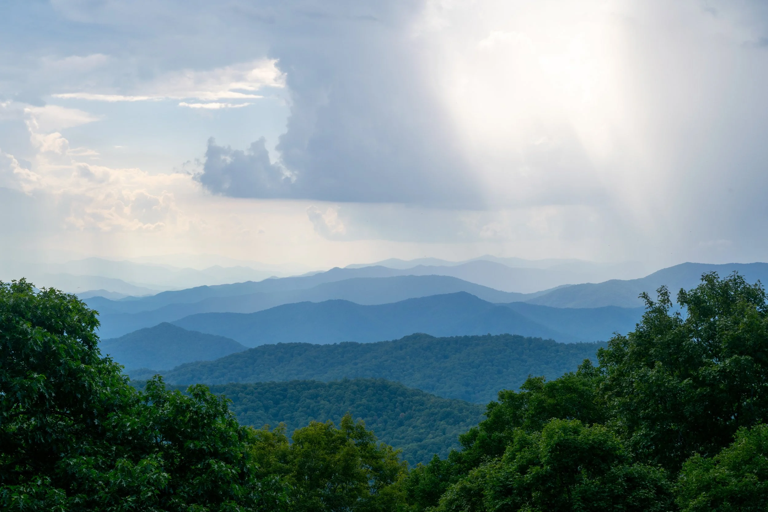 Layers upon layers of hills step through many shades of blue.