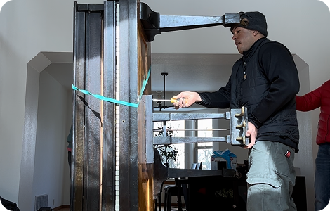 Senior mover securing furniture for relocation
