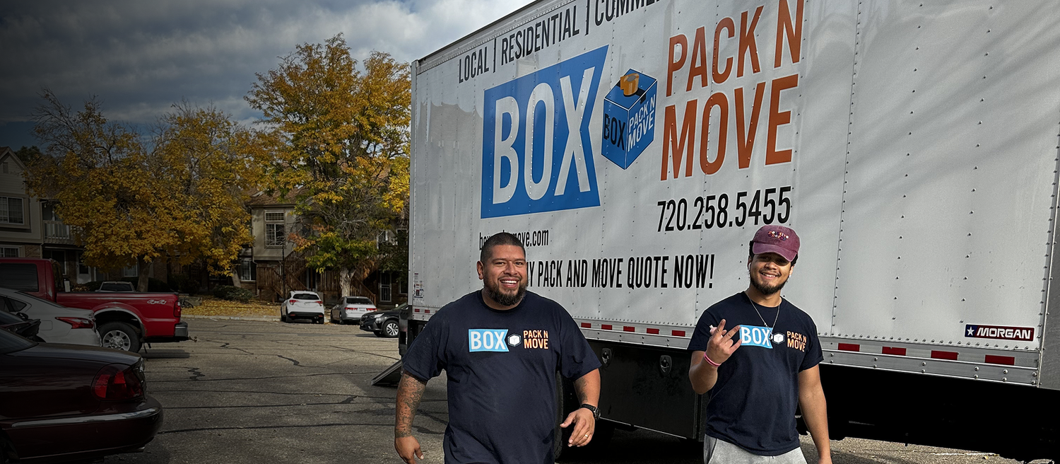 Denver movers standing beside a Box Pack N Move truck
