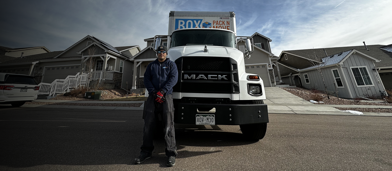 Fountain moving company crew beside a moving truck