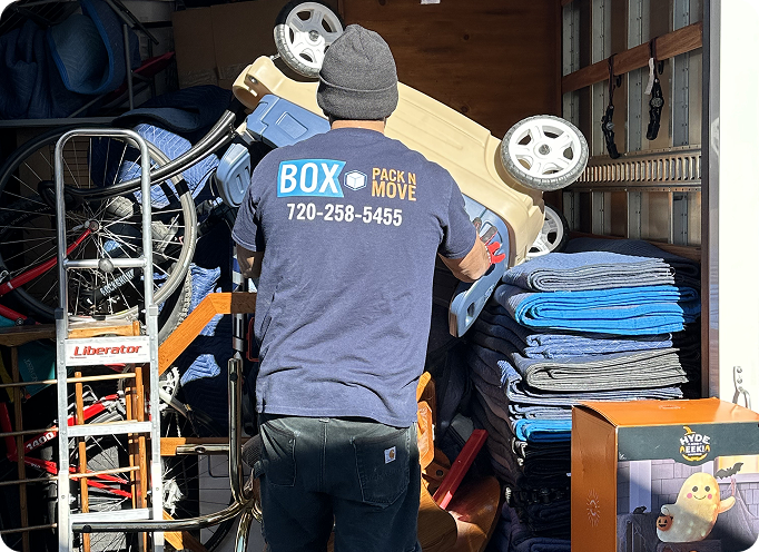 Professional movers loading bulky household items