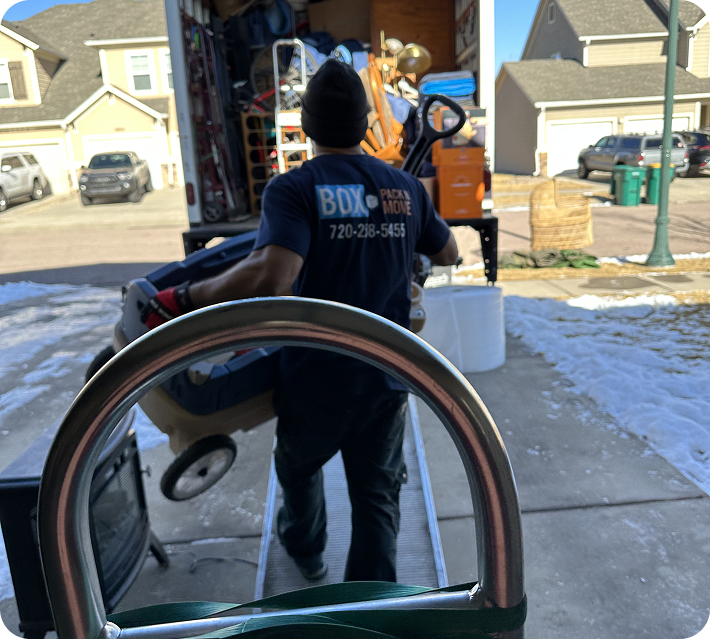 Pueblo mover loading household items into a truck
