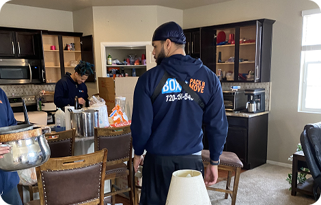 Furniture delivery mover beside a moving truck