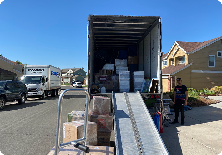 Moving truck with ramp for gym equipment relocation