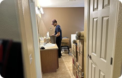 Professional packer packing household items