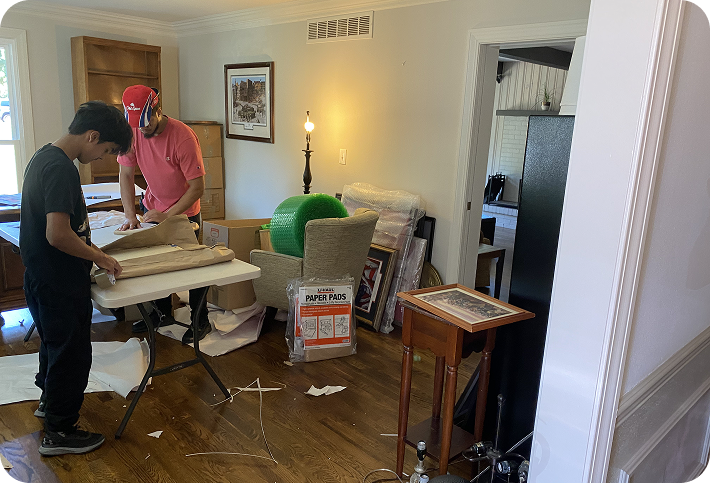 Household packing crew wrapping belongings