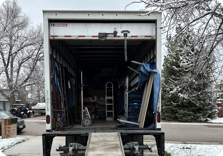 Residential moving truck with loading ramp ready for a household move
