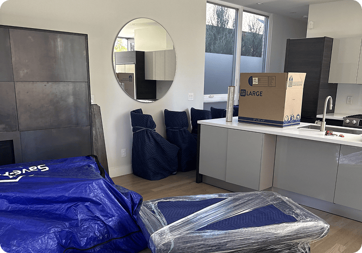 Wrapped furniture and moving boxes ready for home decluttering