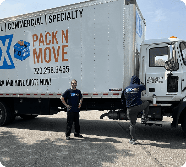 Lone Tree movers beside a moving truck