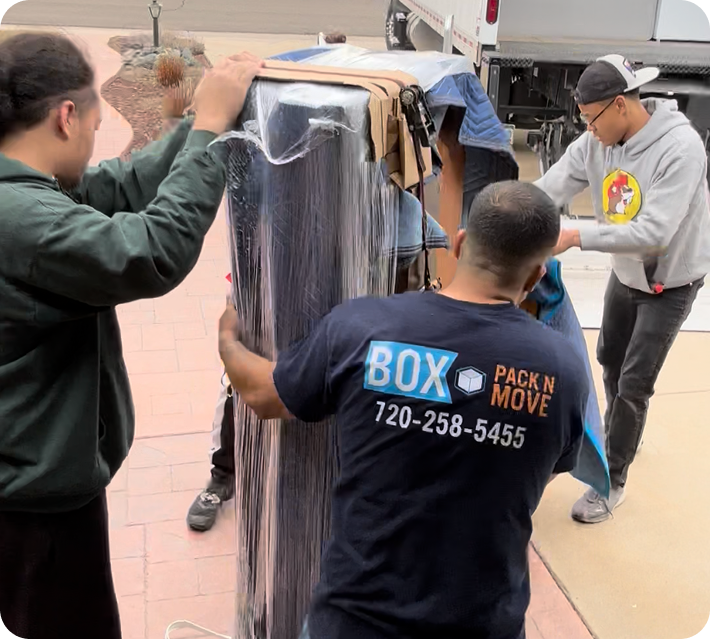 Colorado Springs movers wrapping large furniture