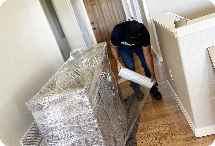 Moving professional wrapping furniture for safe transport