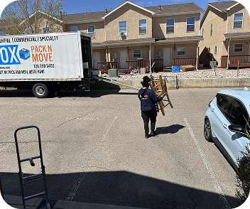 Moving crew carrying unwanted household items