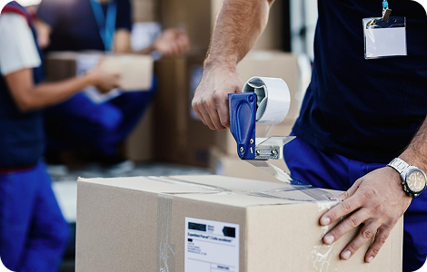 Professional mover sealing boxes for transport