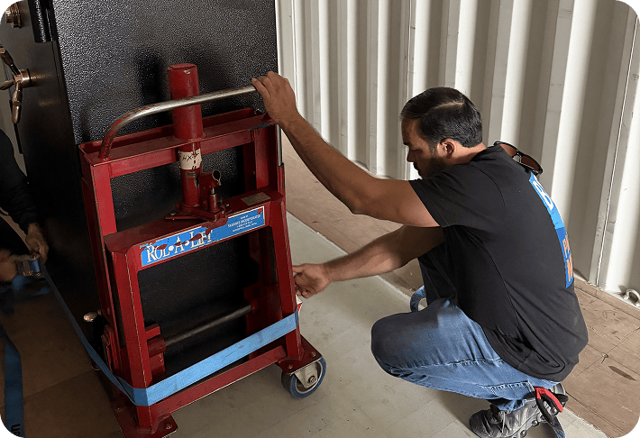 Professional gun safe handling with moving equipment