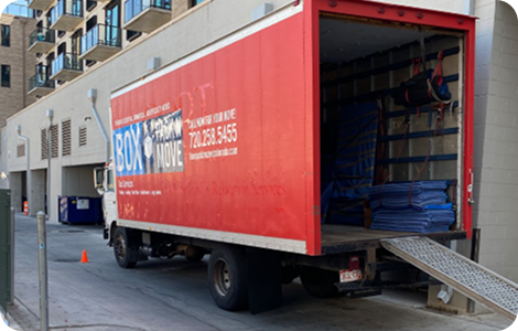 Specialty moving truck with loading ramp