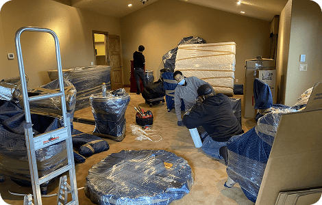 Residential movers protecting household furniture
