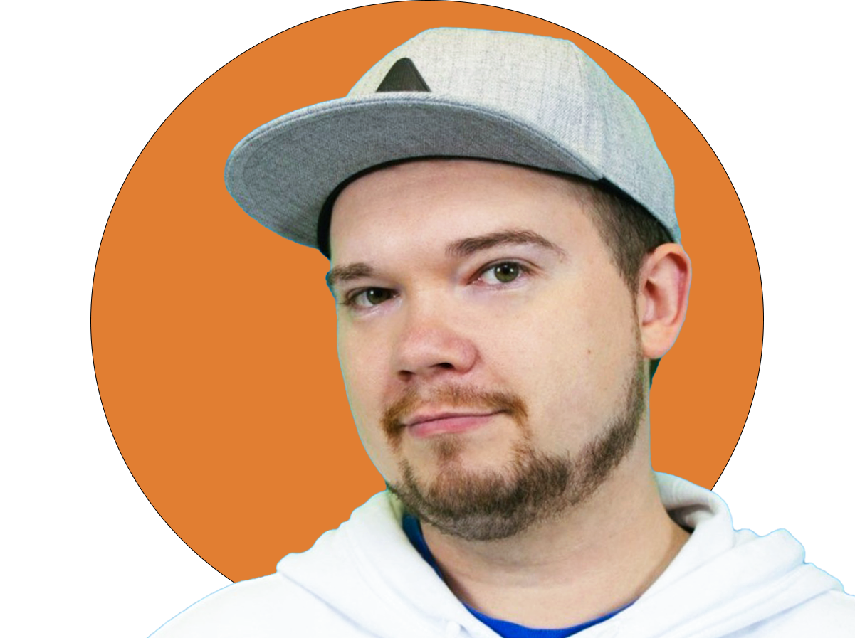 A young man with a beard and mustache wearing a gray baseball cap and a white hoodie, standing in front of an orange circle background.