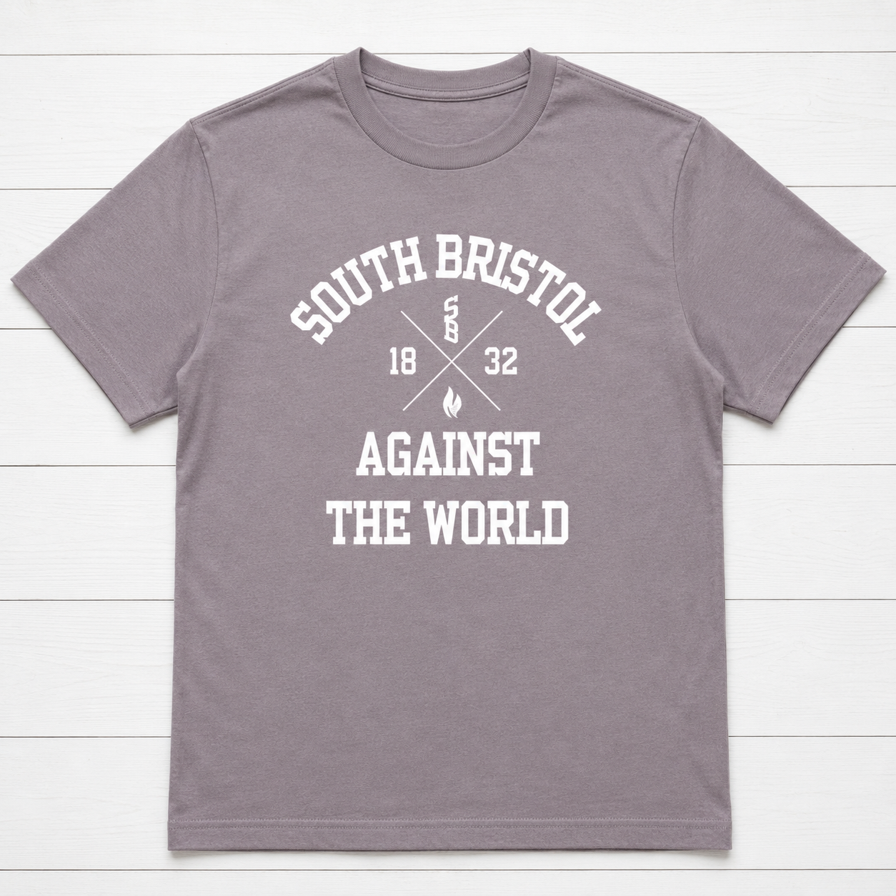 Gray T-shirt with white text and graphics reading "South Bristol Against The World," with additional smaller text, numbers, and flame symbols.