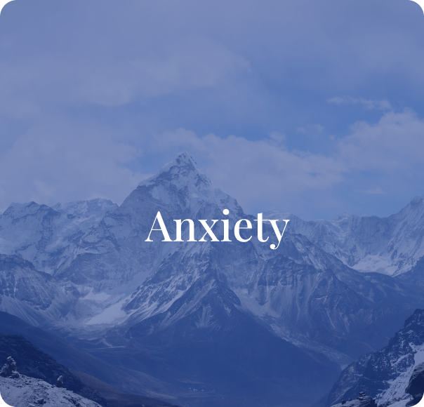 Snow-capped mountain range with the word 'Anxiety' overlaid in white text.