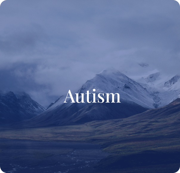Snow-capped mountains under cloudy sky with the word "Autism" in the foreground.
