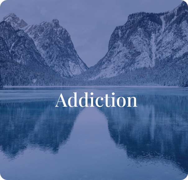 Snow-capped mountains and a calm lake reflecting the mountains with the word 'Addiction' in the center.
