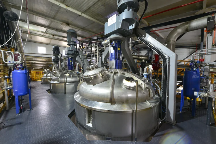 Large stainless steel production fermenters with top-mounted agitator drives