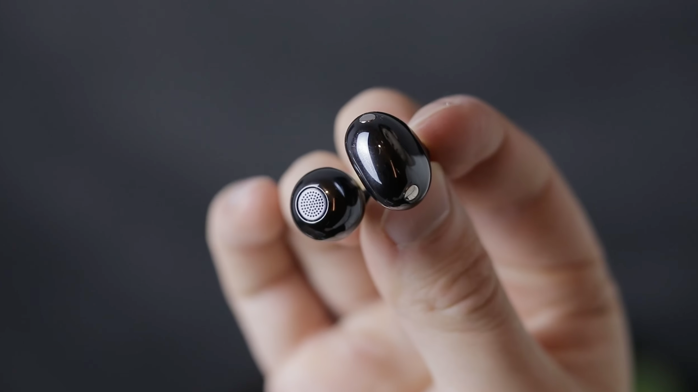 black earbud showing a Huawei C-bridge design