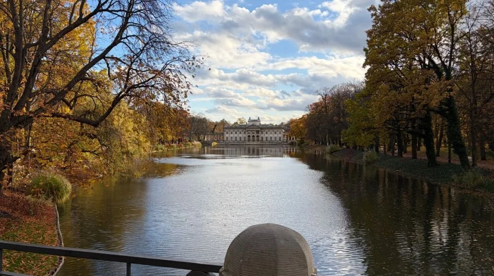 iPhone Air camera sample: river lined with autumn trees