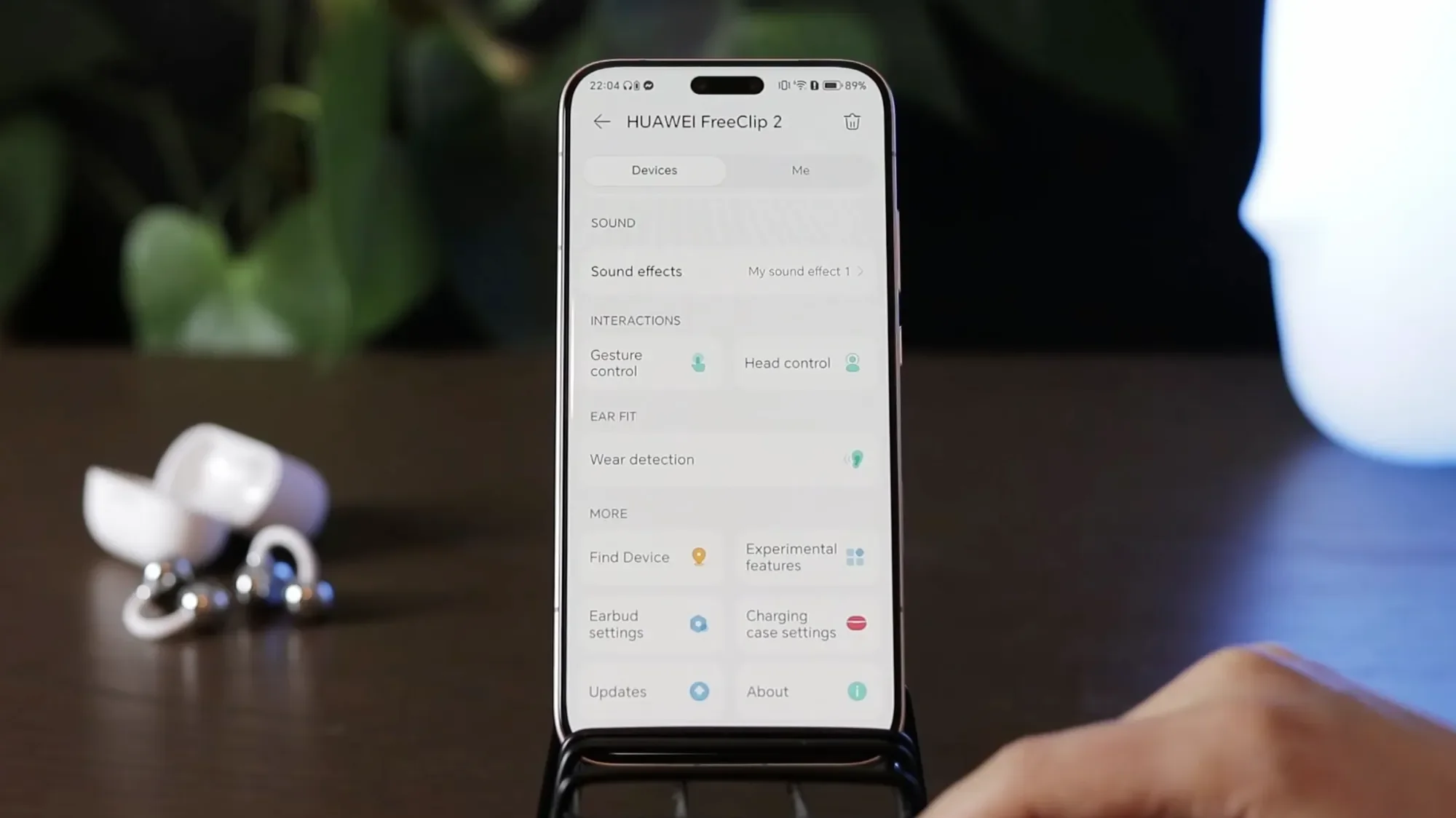 Huawei Audio Connect app on a phone next to the FreeClip 2 earbuds