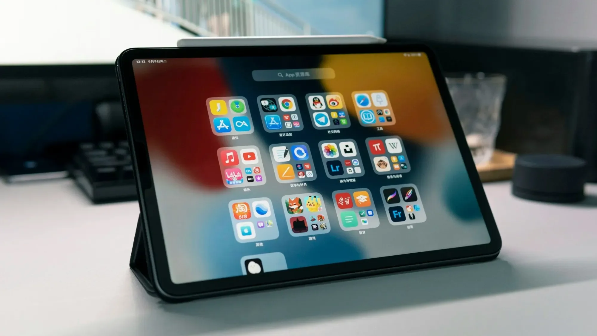 Tablet showing its home screen on a desk