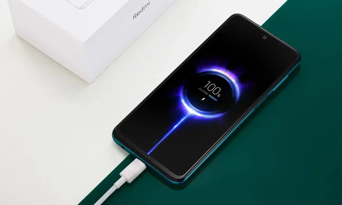 Phone plugged into a Xiaomi charging cable, showing the fast-charging animation