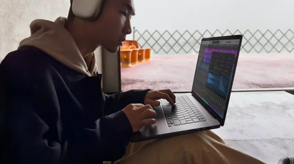 Student using Apple Creator Studio apps on a MacBook