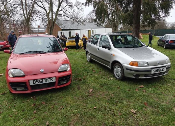 Red Fiat Seicento and silver Fiat Punto
