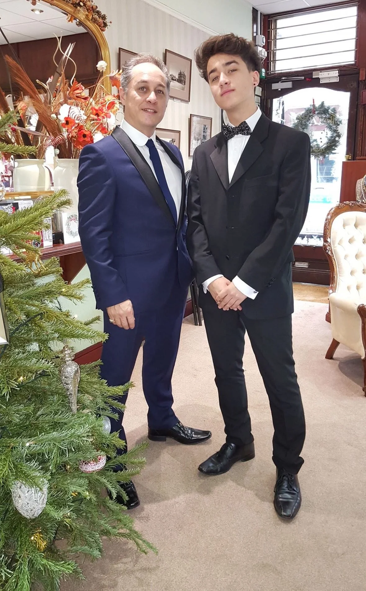 Old photo of Conor Mason and Geoff Mason standing inside Thomas French Jewellers in Bexhill in 2026, part of the Mason Jewellers group