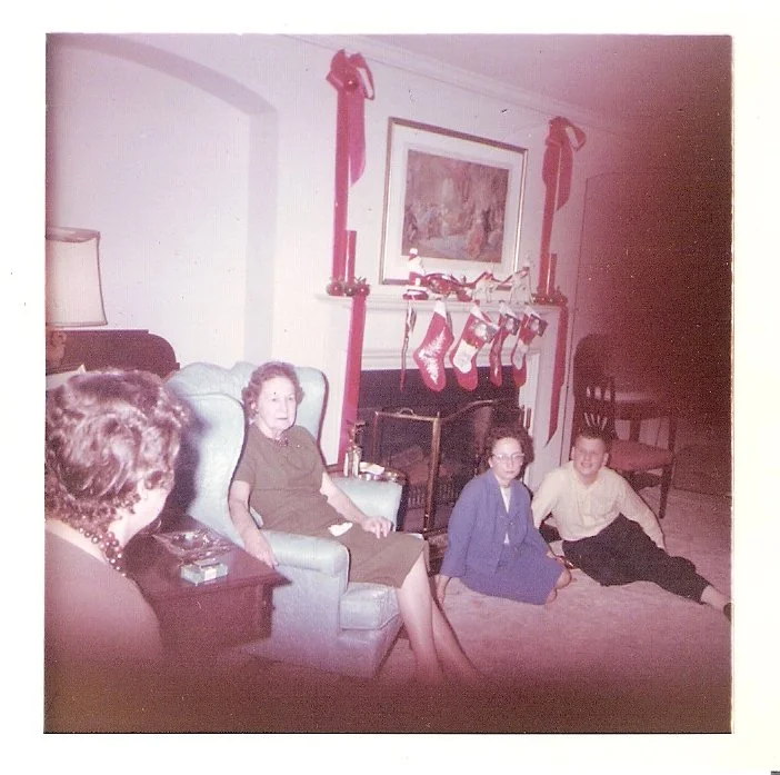 Choice is sitting on the floor next to her brother George.  Her grandmother Alice Cleveland is sitting in the armchair.