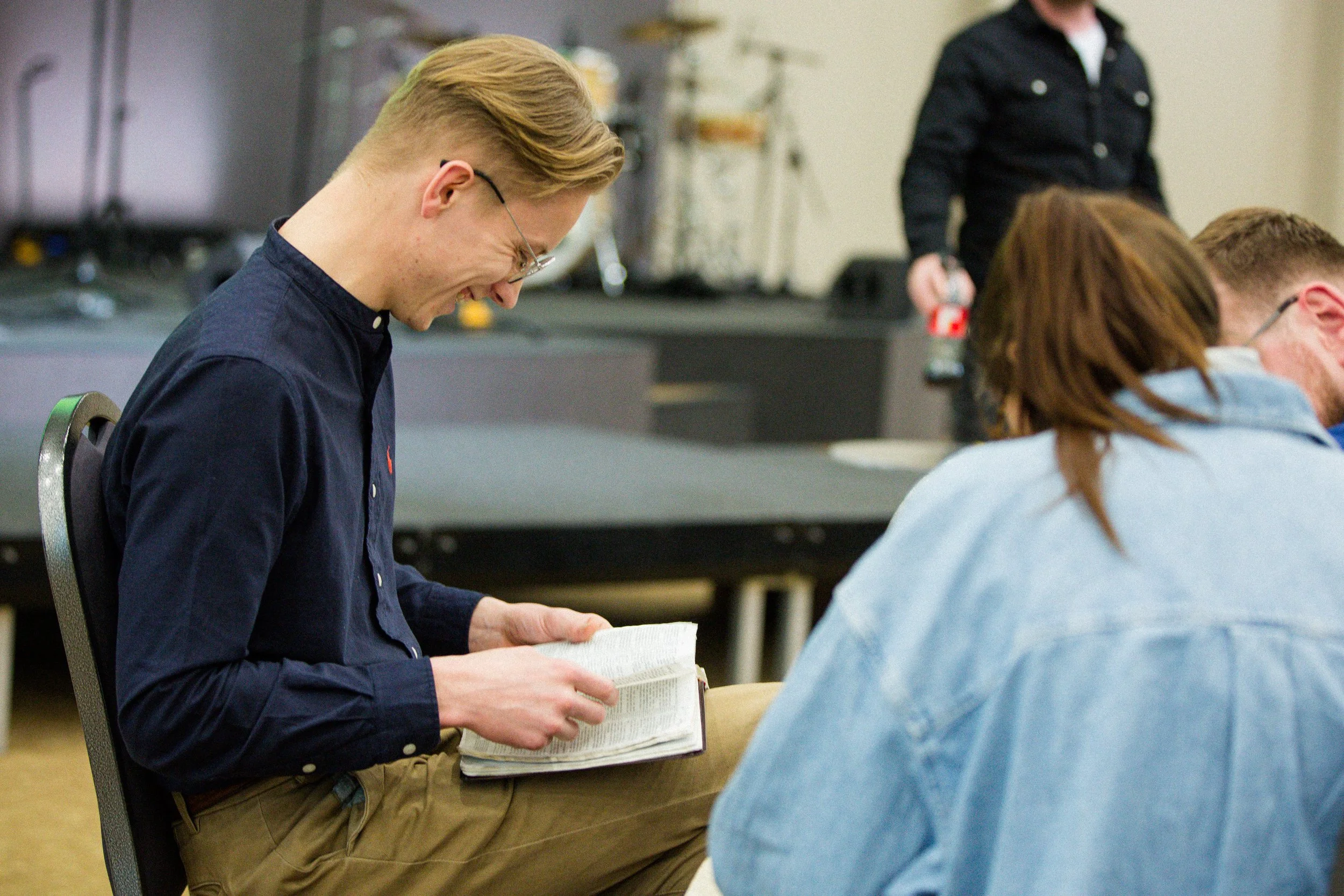 Man reading the Bible in a group study