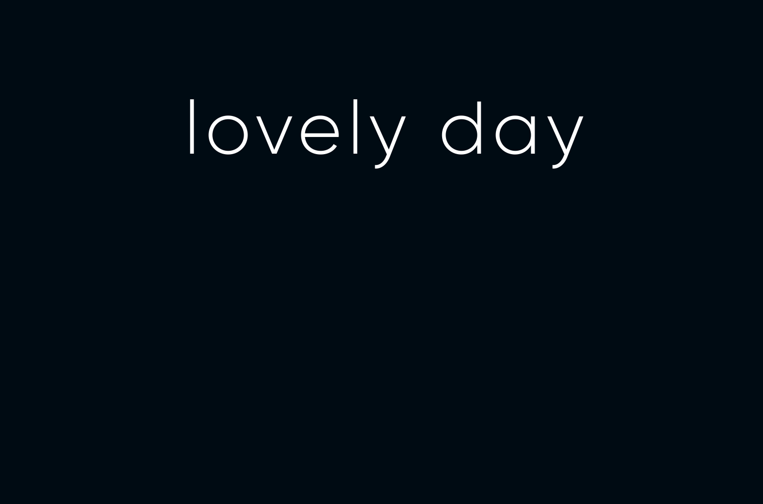 The image displays the words 'lovely day' on a dark background.