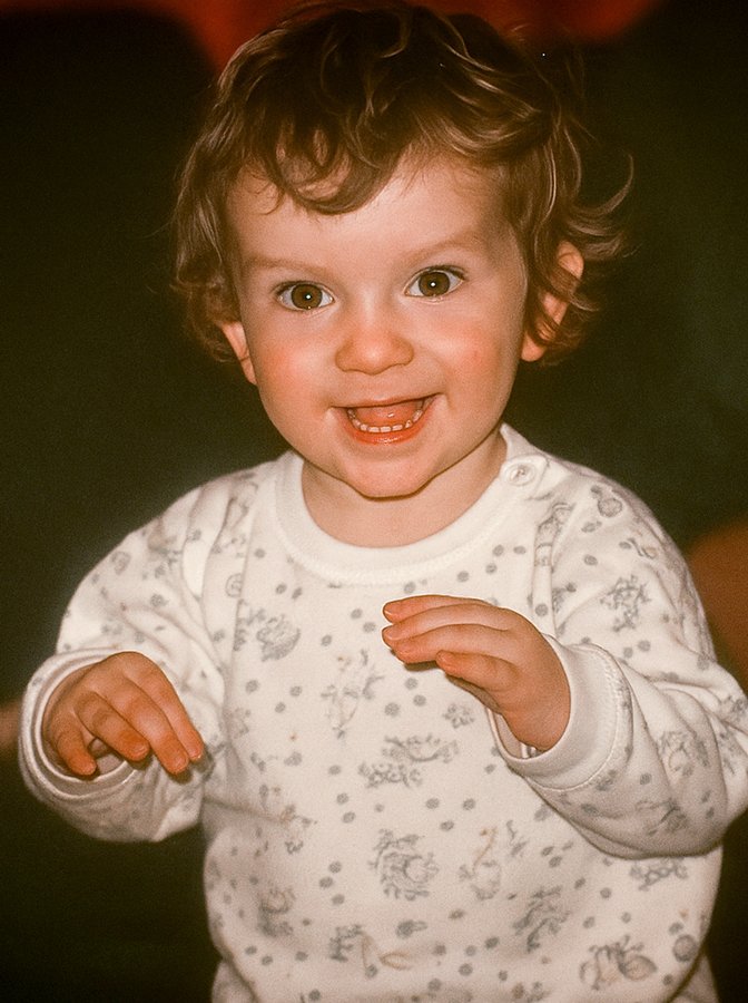 Childhood photograph of British voice actor Guy Kendall as a smiling toddler.