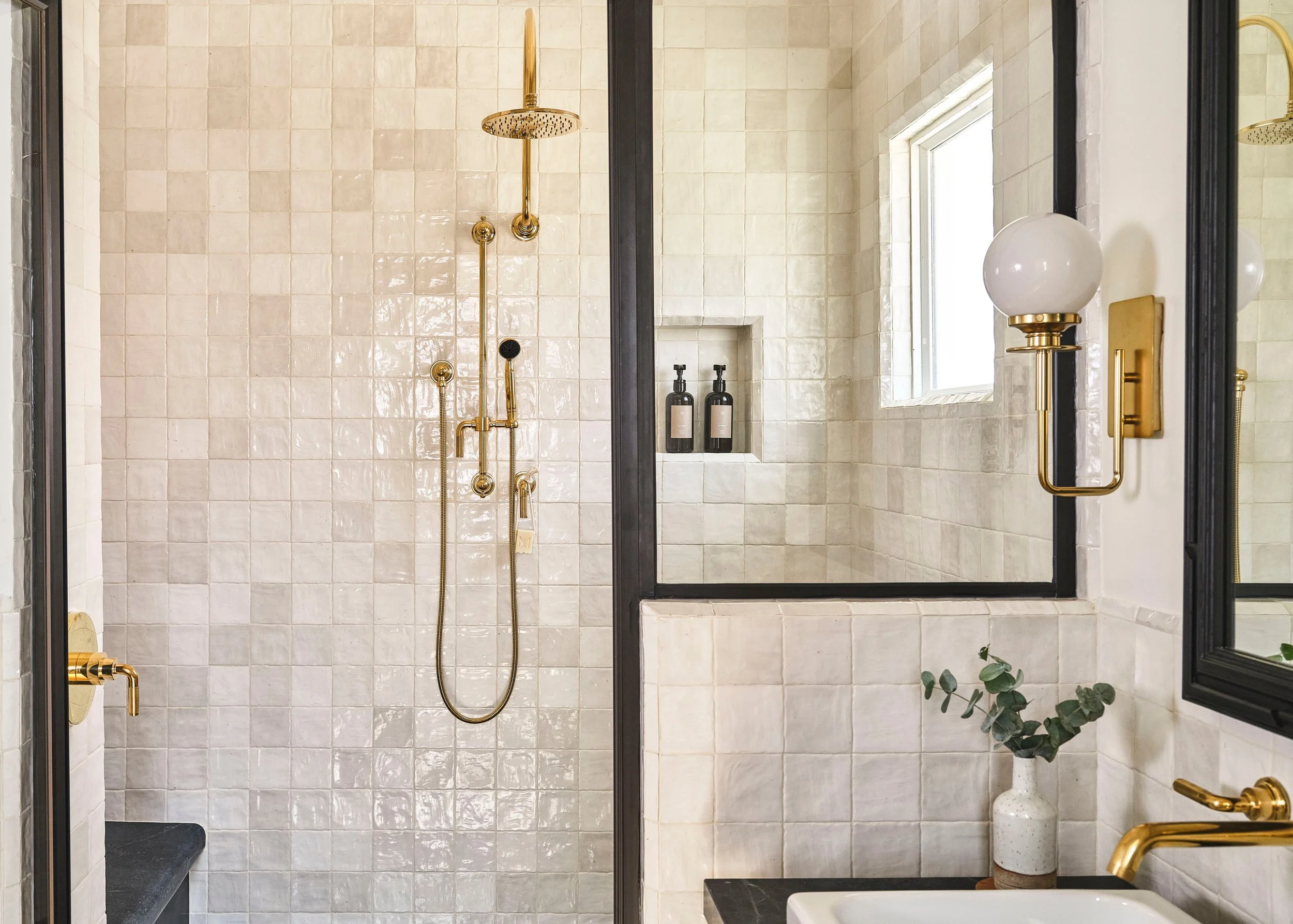 Handmade Zellige, polished brass, and a black steel-framed glass partition. This shower is all about texture and warm light.

Finishes: @dacbuilds
Architecture: @dmhaarchitecture
Design: @nicolecampion
Photography: @ingallsphoto
Resort: @matteistaver