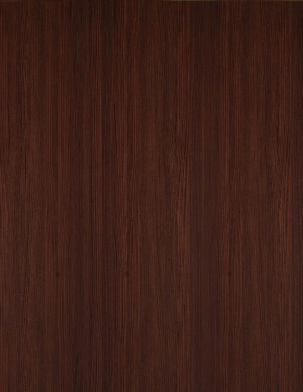 A close-up view of a wooden surface with a dark reddish-brown finish.
