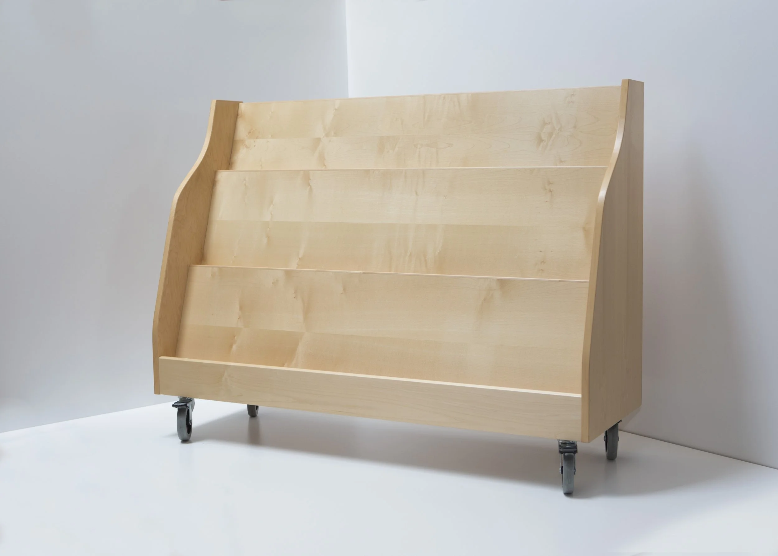 Light-colored wooden rolling cart with multiple shelves, standing on caster wheels against a plain white background.