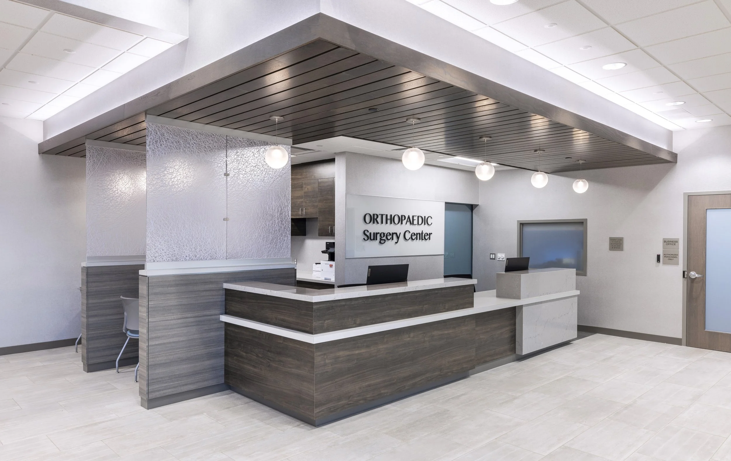 Reception area of an orthopedic surgery center with a modern design.